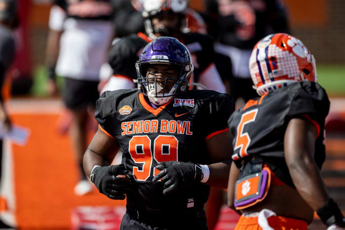 Jan 31, 2023; Mobile, AL, USA; National defensive lineman Adetomiwa Adebawore of Northwestern (99) practices during the first day of Senior Bowl week at Hancock Whitney Stadium in Mobile. Mandatory Credit: Vasha Hunt-USA TODAY Sports